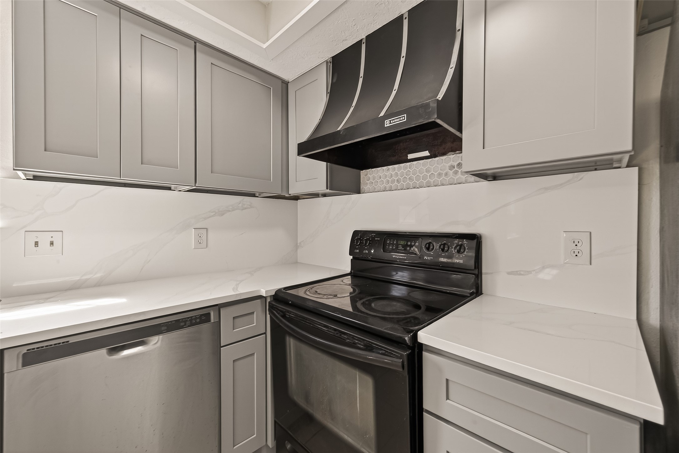 9503 Turtle Log Trail Houston, TX 77064 - Photo 22 of 41 a kitchen with a stove and a microwave