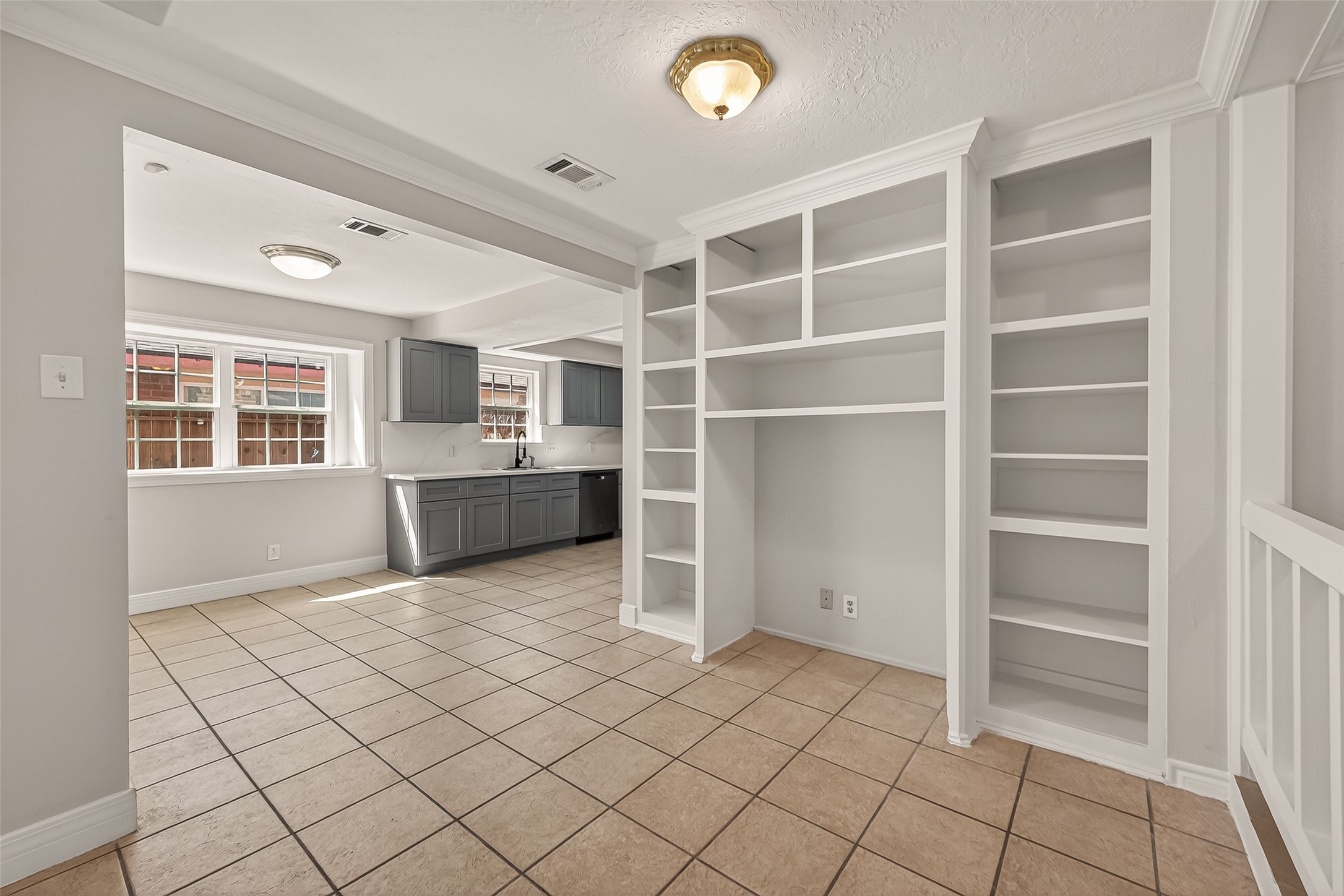 9503 Turtle Log Trail Houston, TX 77064 - Photo 23 of 41 a view of an empty room with cabinet and windows