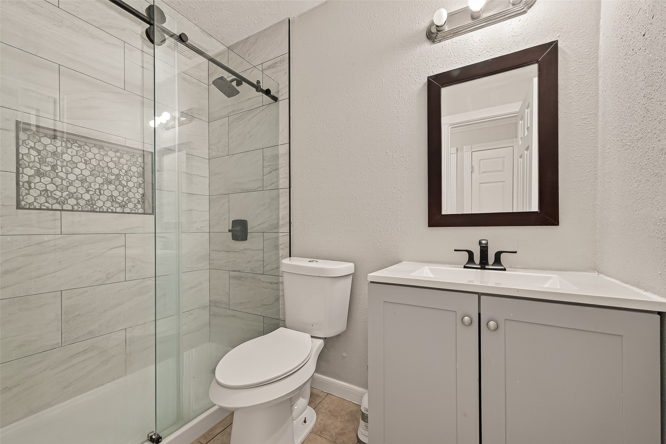 9503 Turtle Log Trail Houston, TX 77064 - Photo 24 of 41 a bathroom with a toilet sink and shower