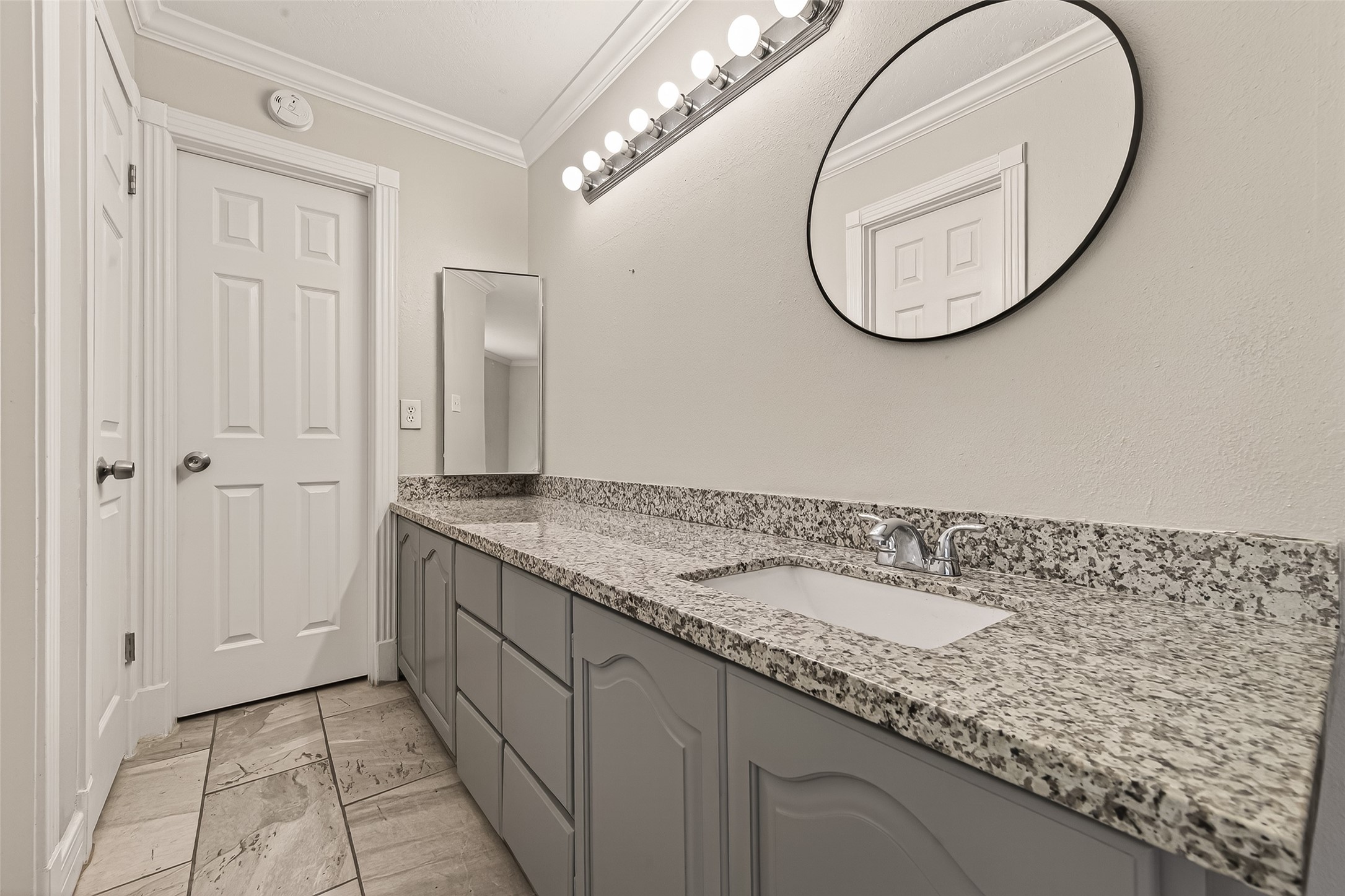 9503 Turtle Log Trail Houston, TX 77064 - Photo 33 of 41 a bathroom with a granite countertop sink and a mirror