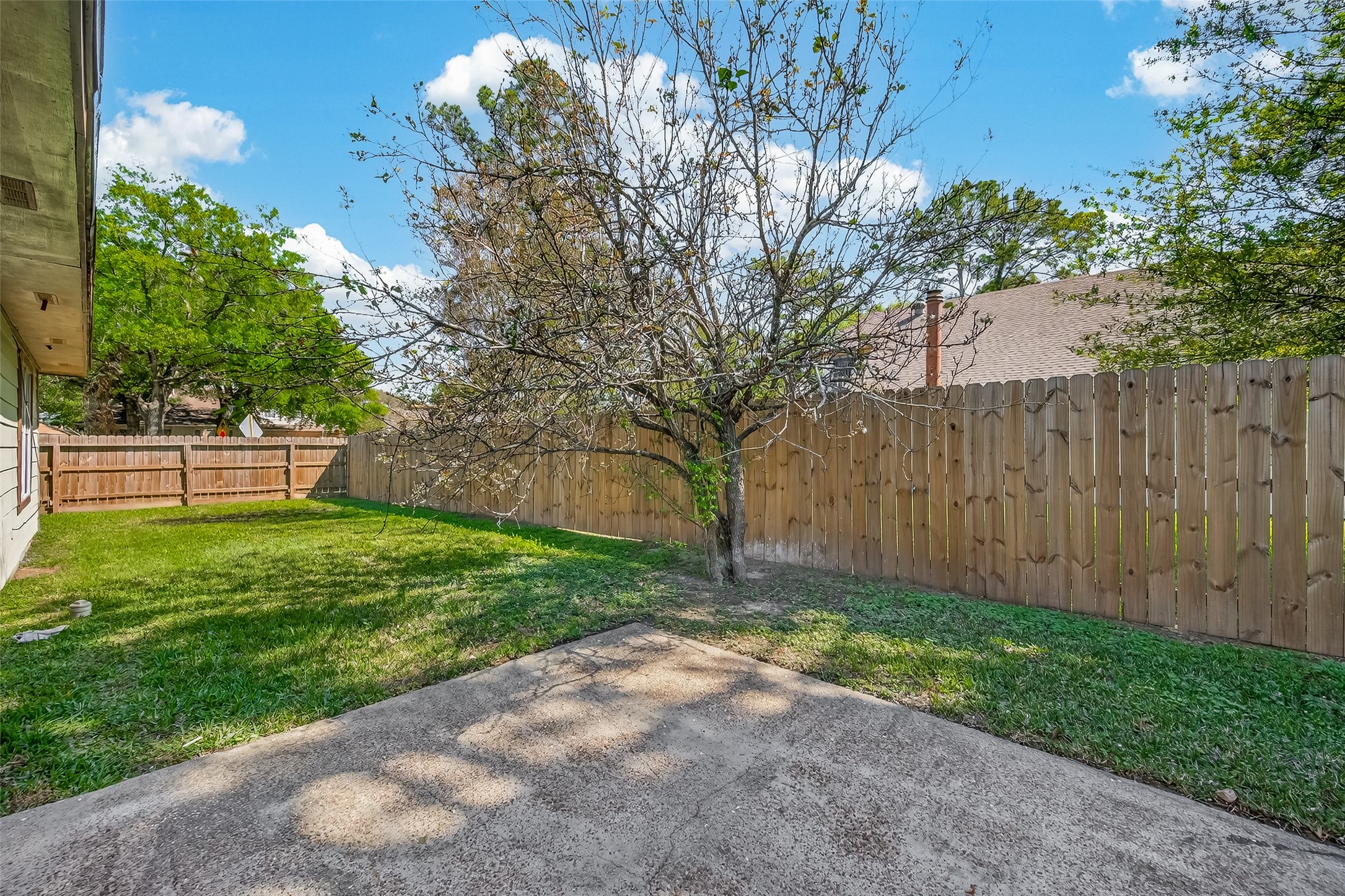 9503 Turtle Log Trail Houston, TX 77064 - Photo 36 of 41 a view of a backyard with large tree
