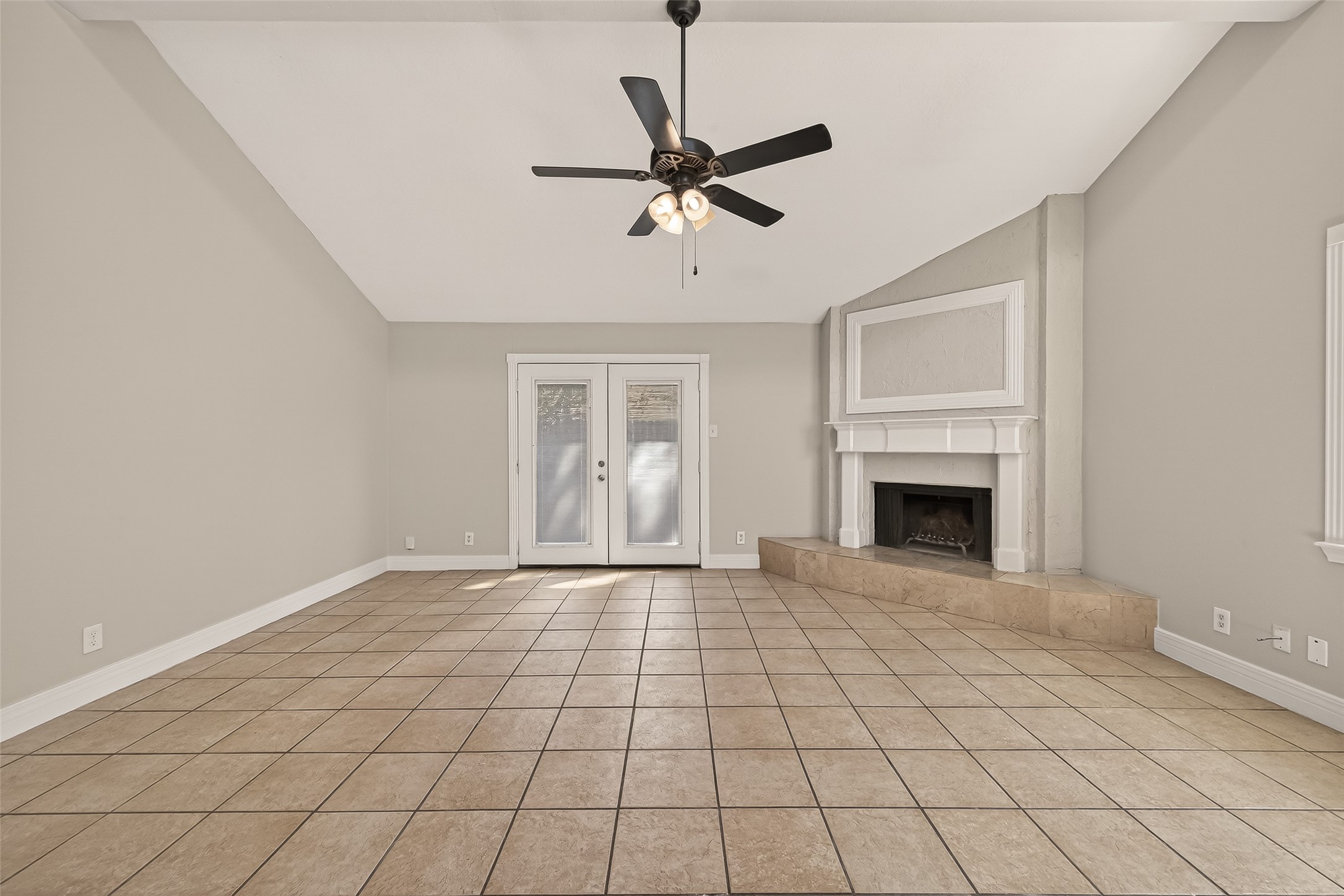 9503 Turtle Log Trail Houston, TX 77064 - Photo 6 of 41 a view of an empty room with a fireplace and a window