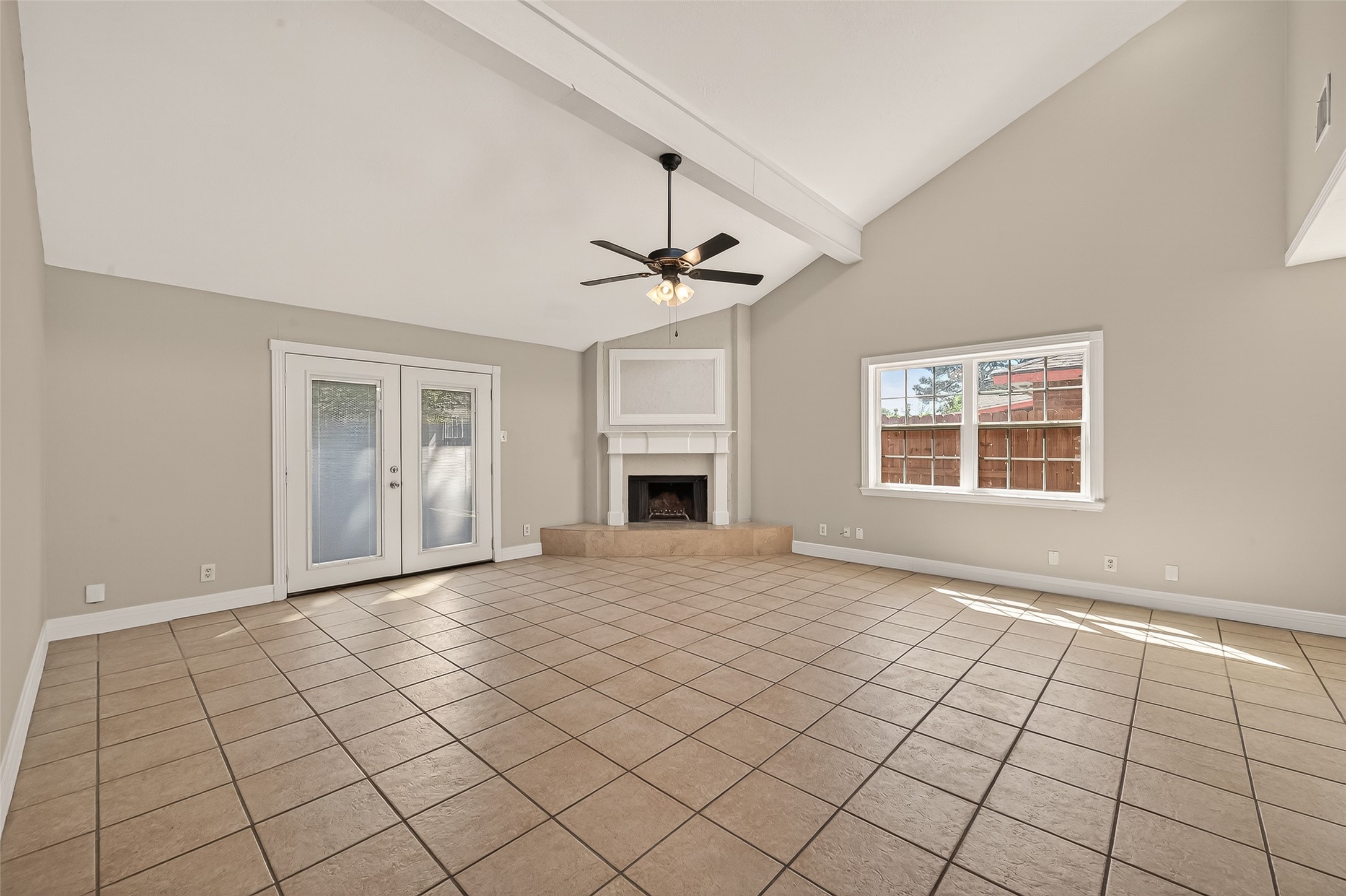 9503 Turtle Log Trail Houston, TX 77064 - Photo 10 of 41 a view of an empty room with a fireplace and a window