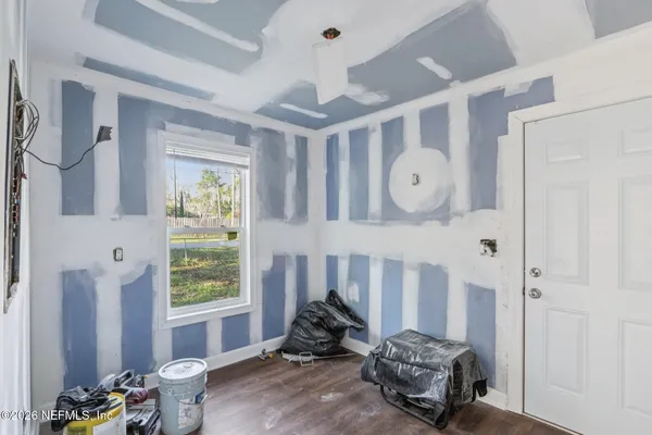 a view of a house with a yard and sitting area