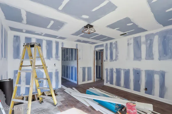 a view of an entryway with wooden floor