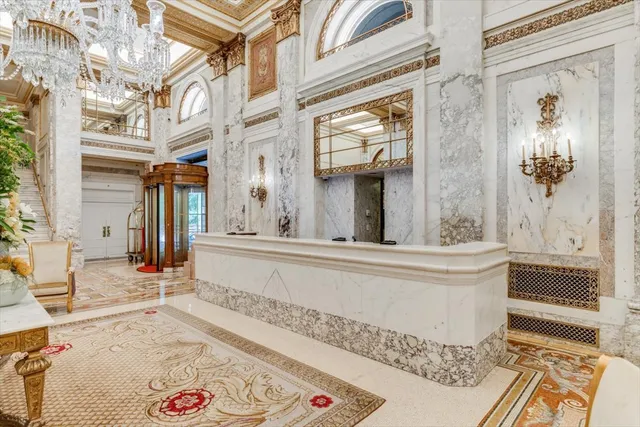 a view of a hallway with wooden floor and closet