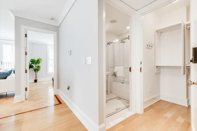 a kitchen that has a sink and wooden floor