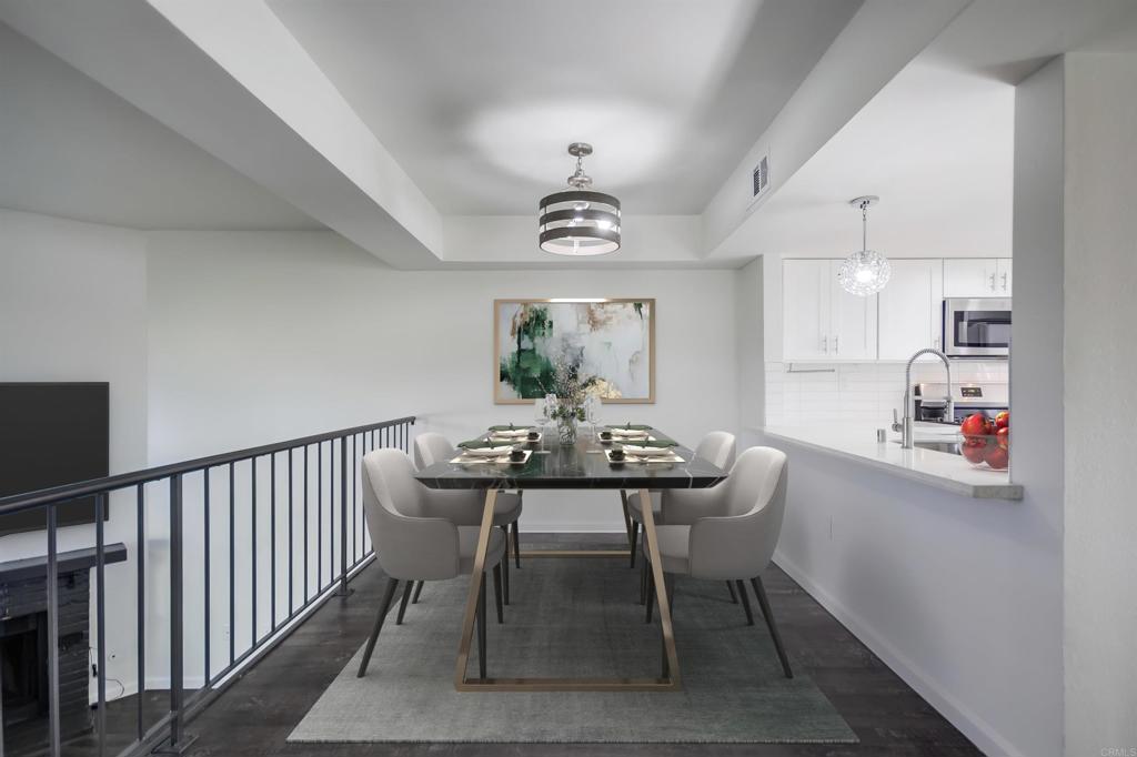 8702 Spring Canyon Drive Spring Valley, CA 91977 - Photo 5 of 22 a view of a dining room with furniture window and wooden floor