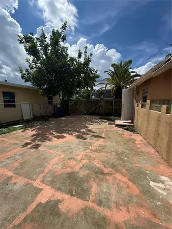 a view of a backyard of a house