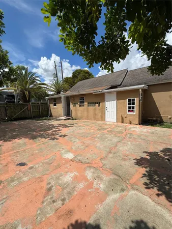 a house with trees in front of it