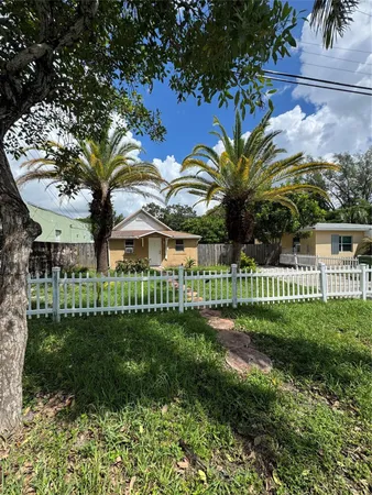 a view of a park with a tree