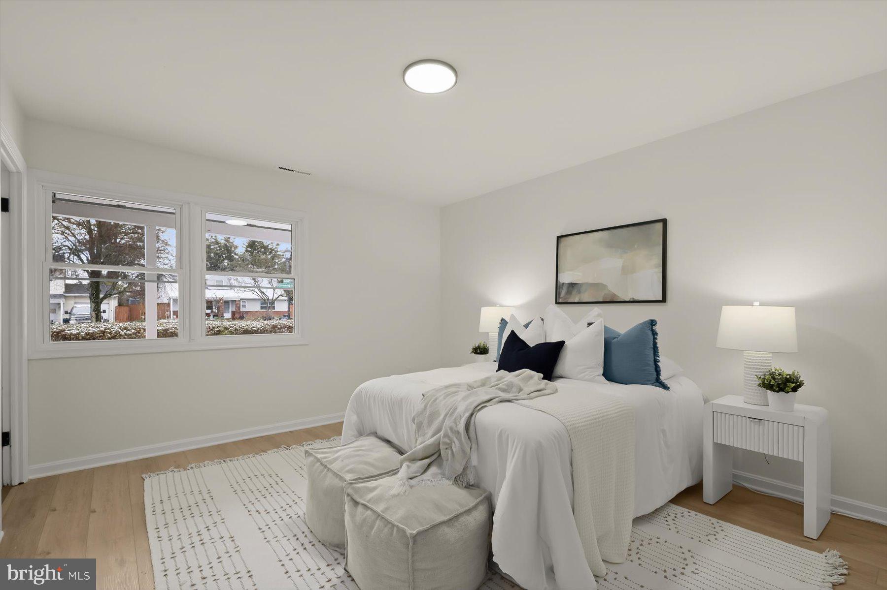 2025 Greengage Road Windsor Mill, MD 21244 - Photo 13 of 28 a bedroom with a bed and a painting on the wall