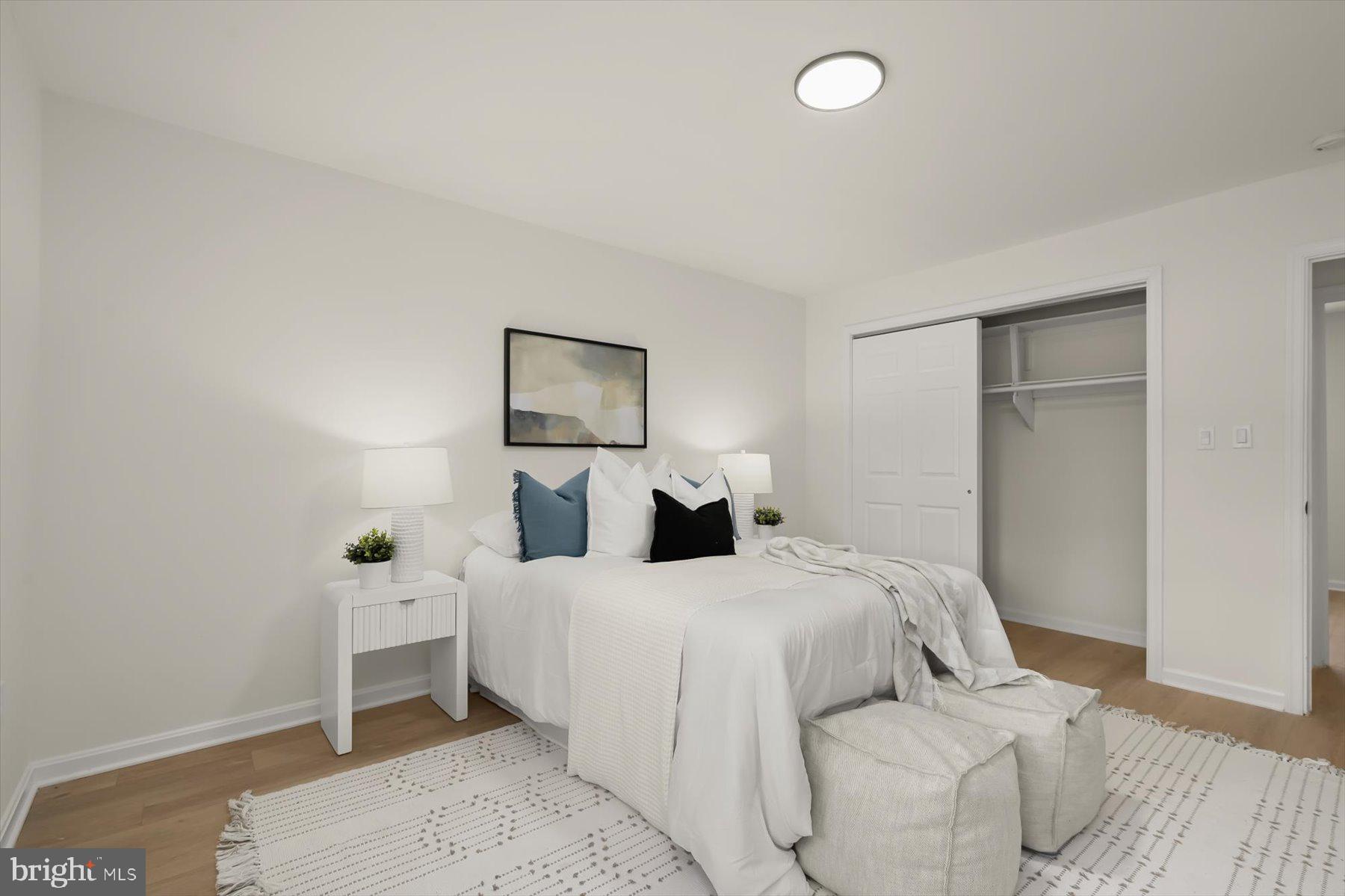 2025 Greengage Road Windsor Mill, MD 21244 - Photo 14 of 28 a bedroom with a bed and a lamp