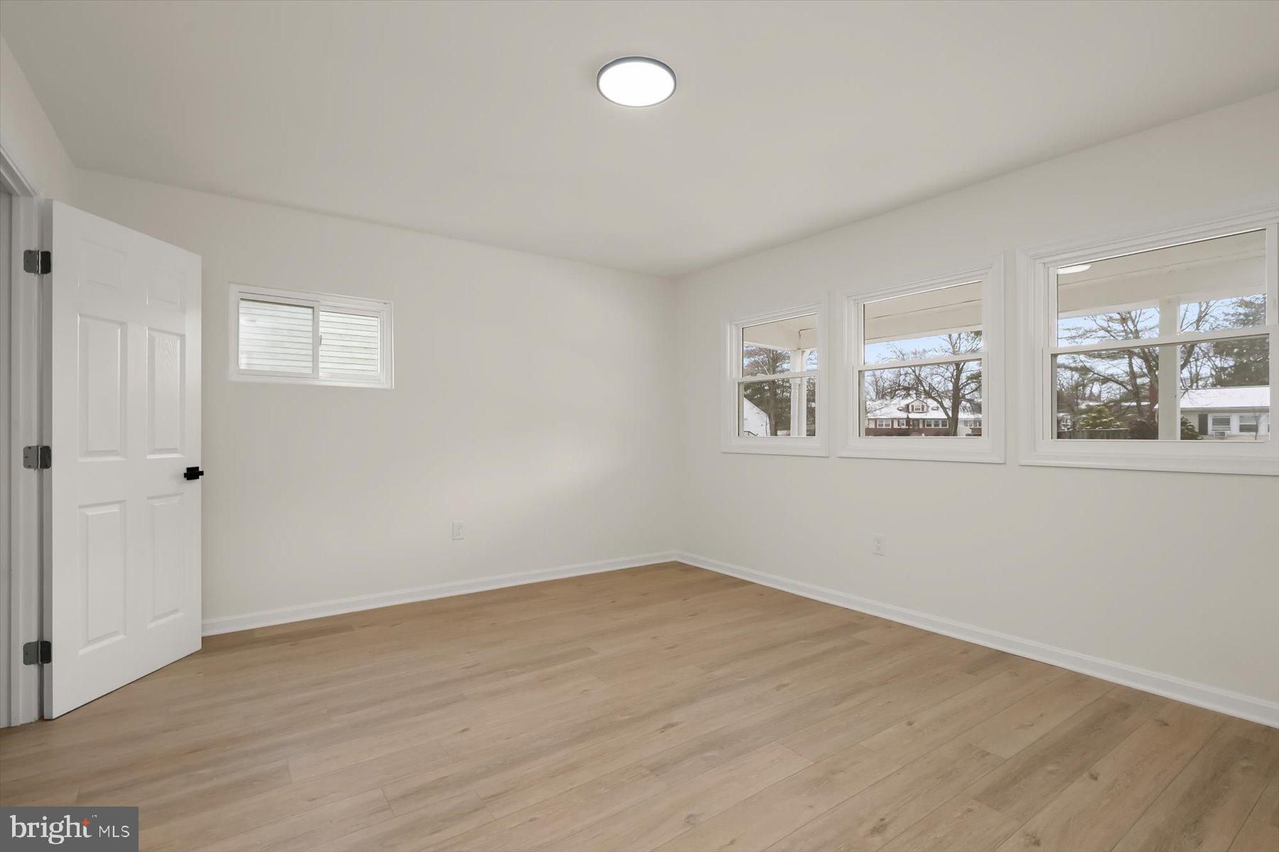 2025 Greengage Road Windsor Mill, MD 21244 - Photo 22 of 28 a view of a room with wooden floor and window