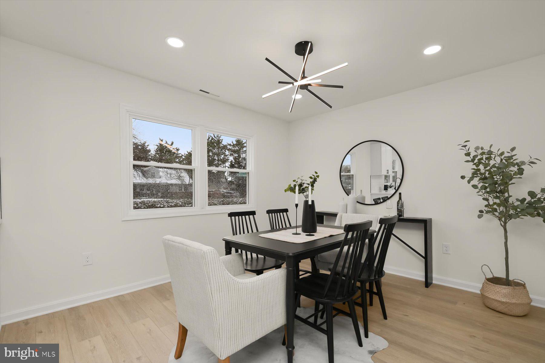 2025 Greengage Road Windsor Mill, MD 21244 - Photo 9 of 28 a view of a dining room with furniture window and wooden floor
