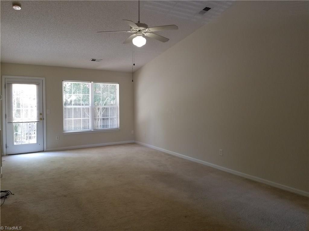 2940 WaterStone Loop High Point, NC 27265 - Photo 2 of 16 The cathedral ceiling Great Room is spacious and fears great wall space for the placement of furniture. There is a fenced landscaped patio area to the rear of this room.