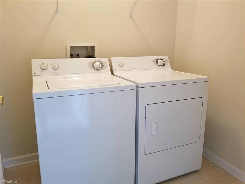 2940 WaterStone Loop High Point, NC 27265 - Photo 13 of 16 The full size laundry room includes this washer and dryer.