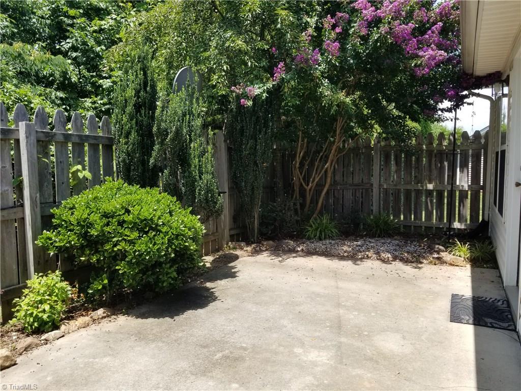 2940 WaterStone Loop High Point, NC 27265 - Photo 14 of 16 The fenced landscaped patio provides great privacy for outdoor entertaining.