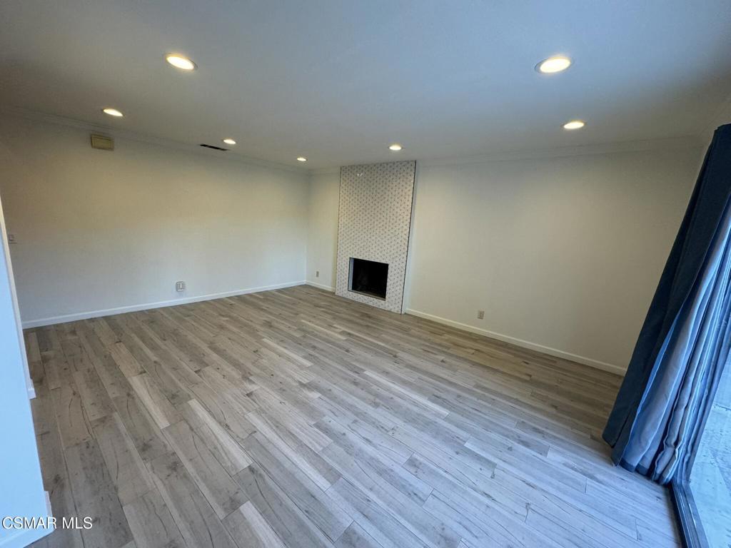 13654 Blacksmith Court Moorpark, CA 93021 - Photo 12 of 34 an empty room with wooden floor and entrance