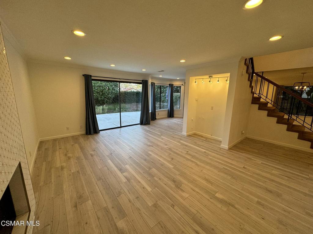 13654 Blacksmith Court Moorpark, CA 93021 - Photo 13 of 34 a view of an empty room with wooden floor and stairs