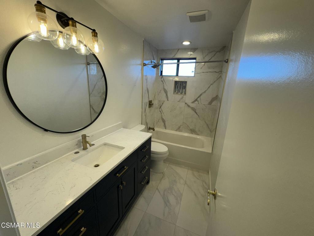 13654 Blacksmith Court Moorpark, CA 93021 - Photo 25 of 34 a bathroom with a double vanity sink mirror and toilet
