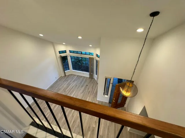 a view of stairs and hall