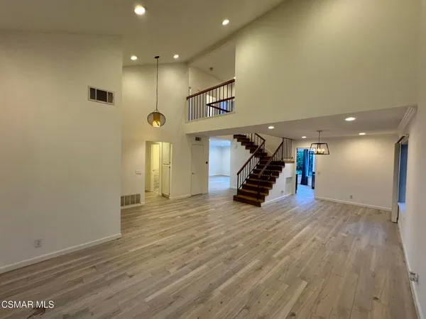 a view of a room with gym equipment and a window