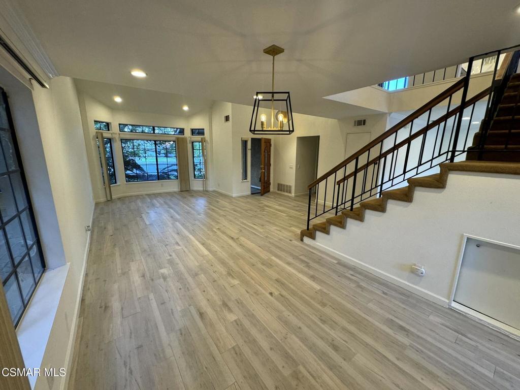 13654 Blacksmith Court Moorpark, CA 93021 - Photo 8 of 34 a view of a livingroom with wooden floor and stairs
