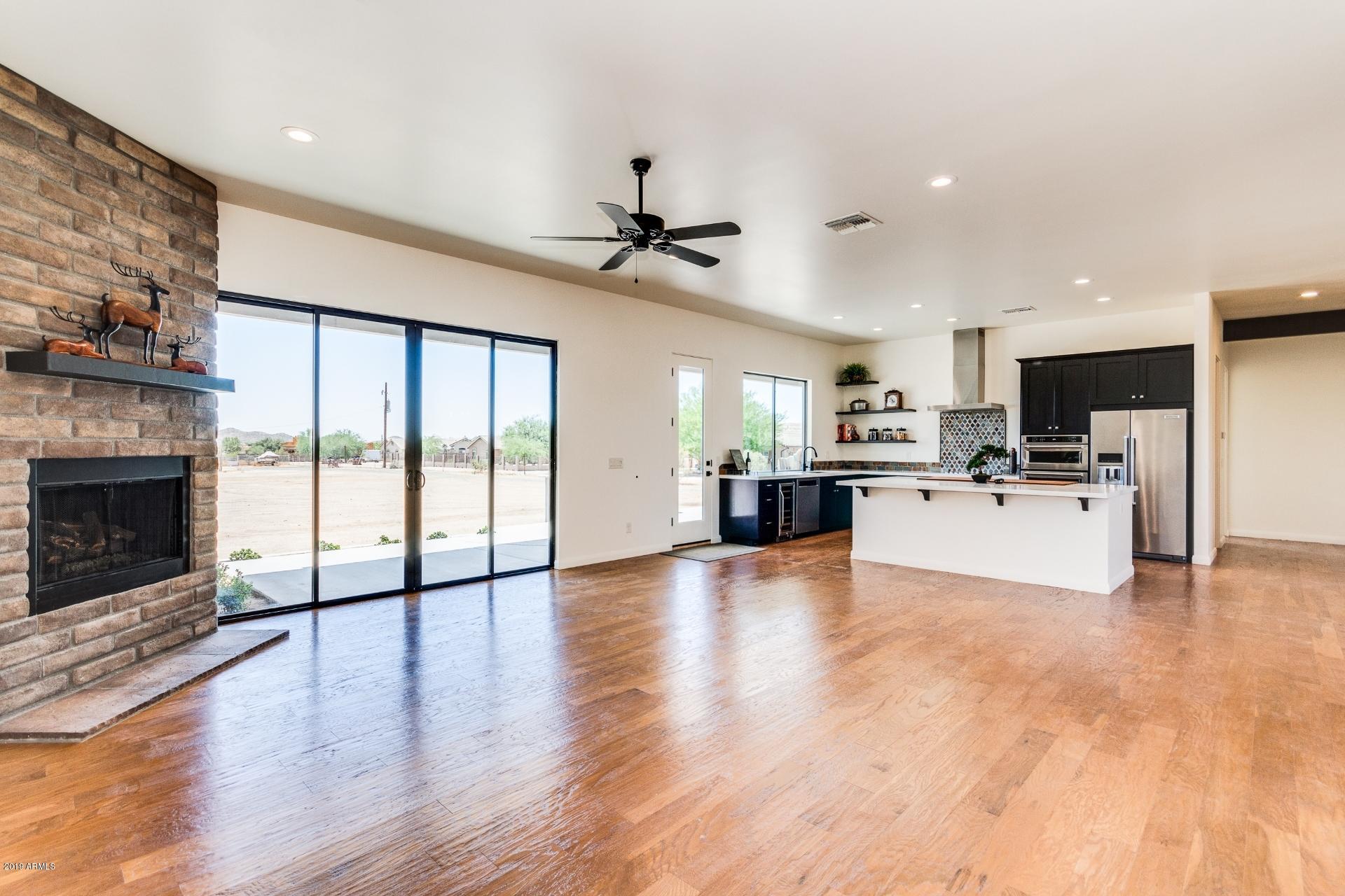 1045 East Joy Ranch Road Phoenix, AZ 85086 - Photo 11 of 39 GREAT ROOM KITCHEN & FIREPLACE