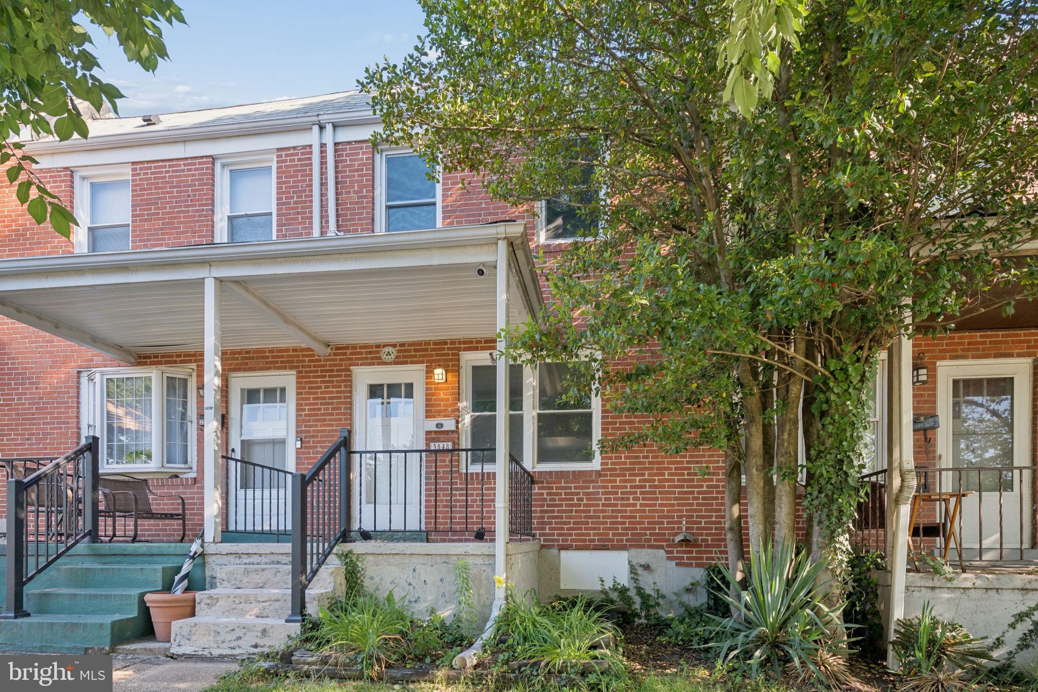 3548 Benzinger Road Baltimore, MD 21229 - Photo 1 of 40 front view of a house with a tree
