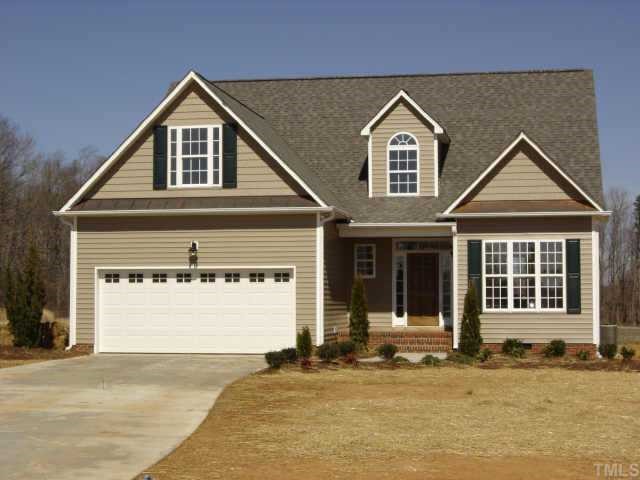 14 Fletcher Ridge Road Timberlake, NC 27583 - Photo 1 of 1 front view of a house with a yard