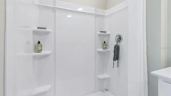 a bathroom with a shower and toilet