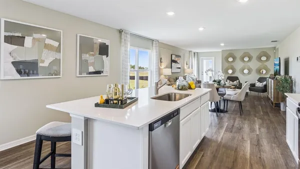 a kitchen that has a table chairs and wooden floor