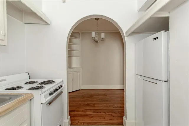 a kitchen with a stove and a refrigerator