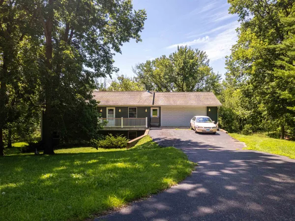 a view of a house with backyard porch and sitting area