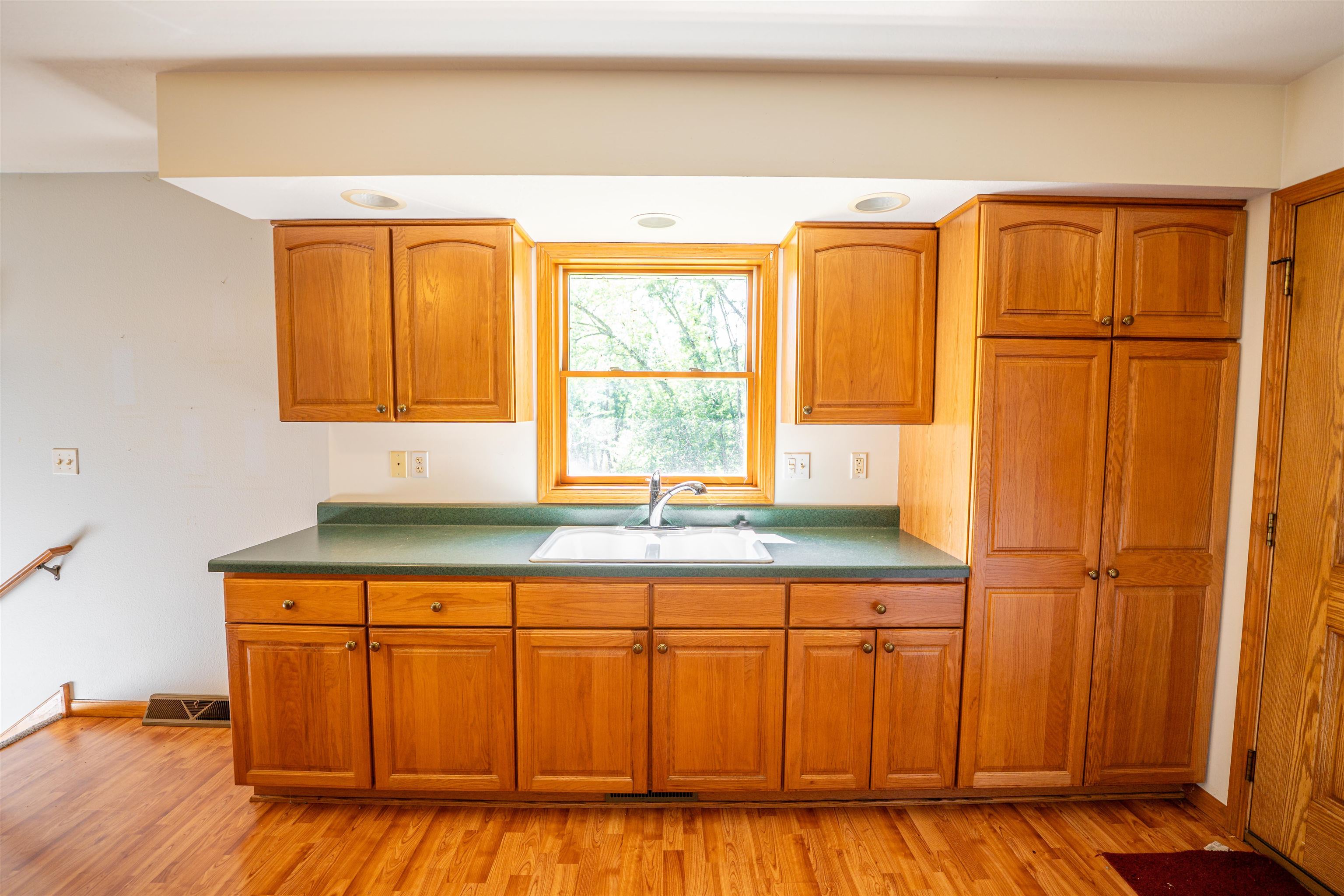 1912 Daysville Road Oregon, IL 61061 - Photo 21 of 74 a kitchen with stainless steel appliances granite countertop a refrigerator a sink and wooden cabinets