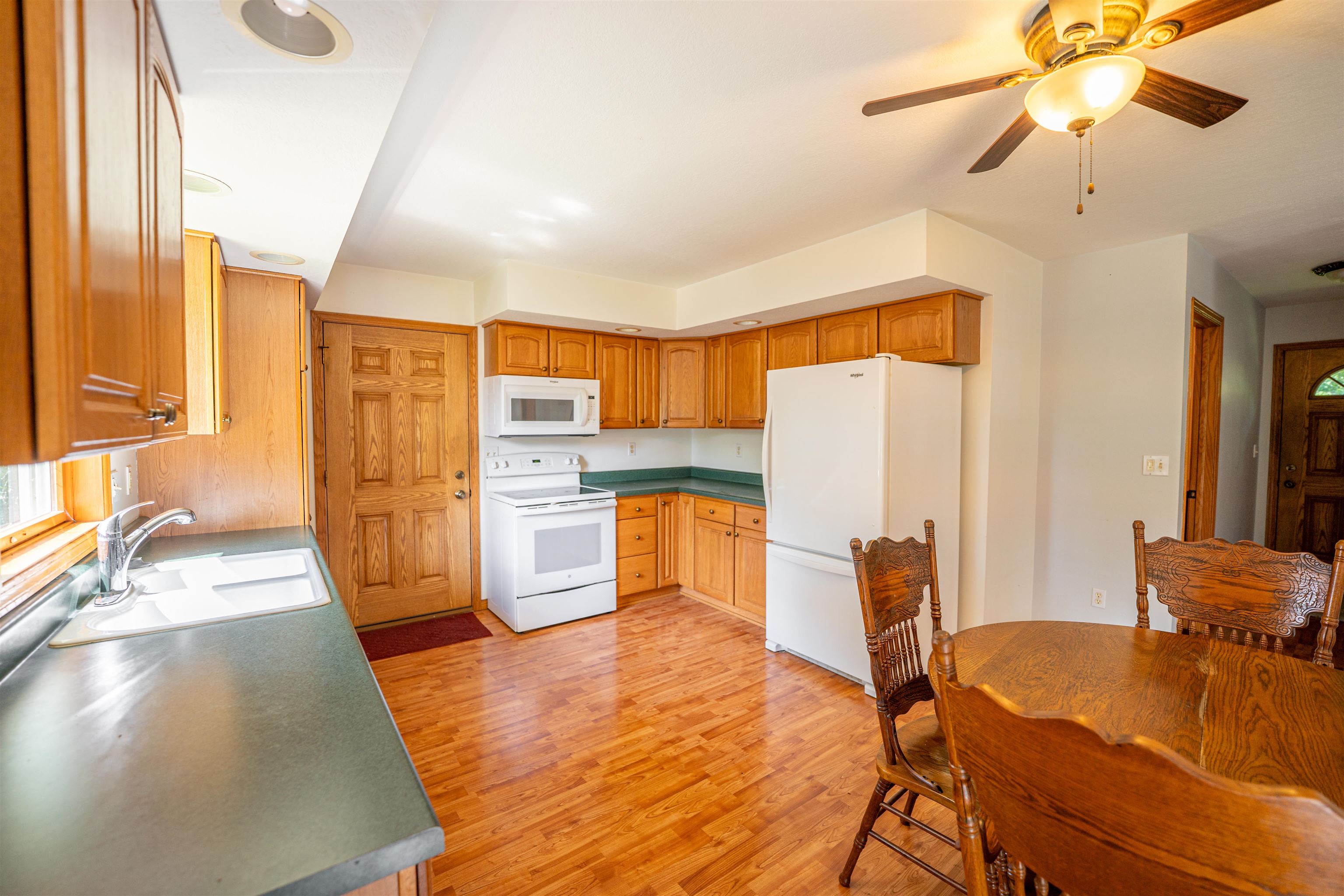 1912 Daysville Road Oregon, IL 61061 - Photo 22 of 74 a living room with stainless steel appliances furniture windows and a kitchen view