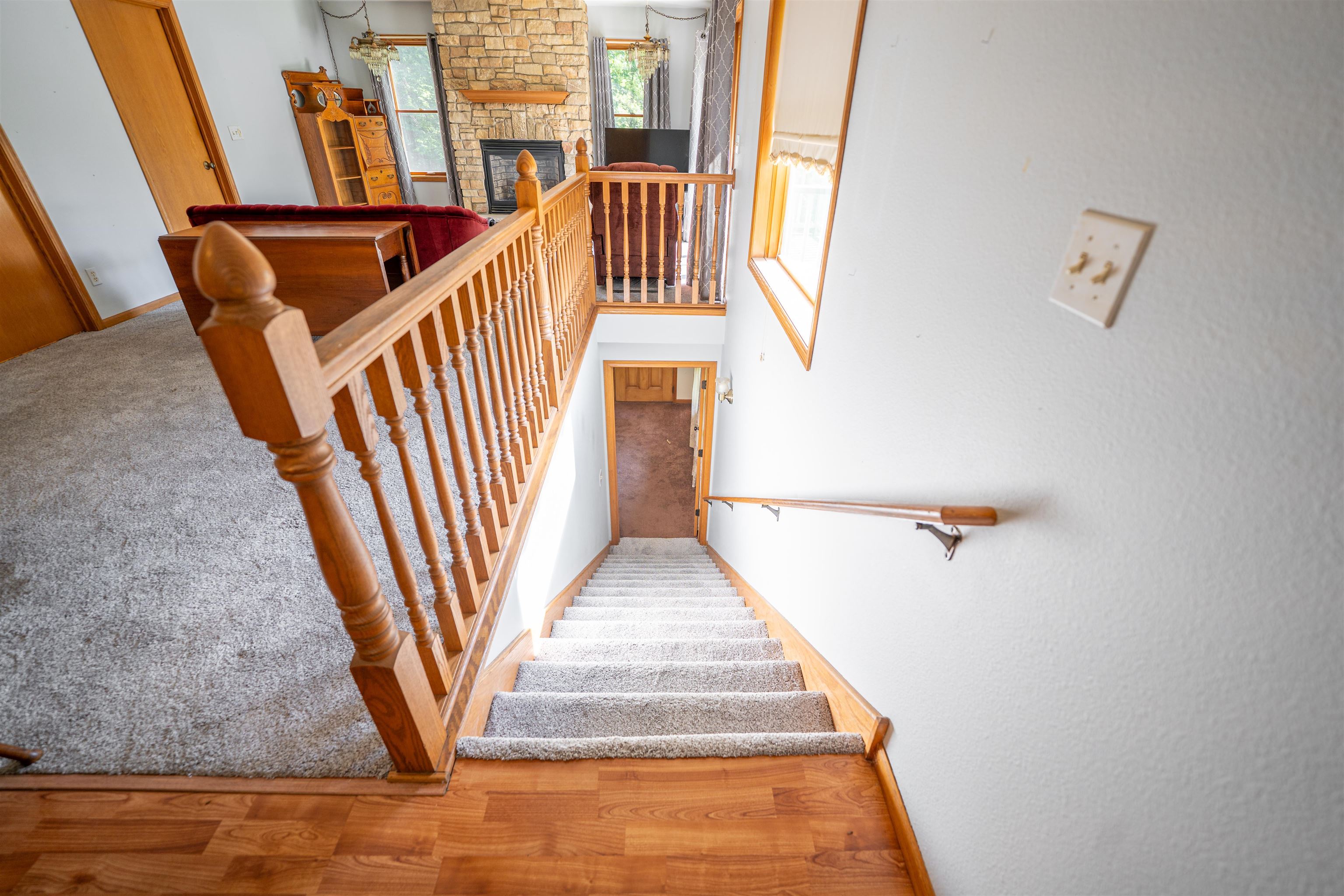 1912 Daysville Road Oregon, IL 61061 - Photo 37 of 74 a view of staircase with lots of frames on wall and windows