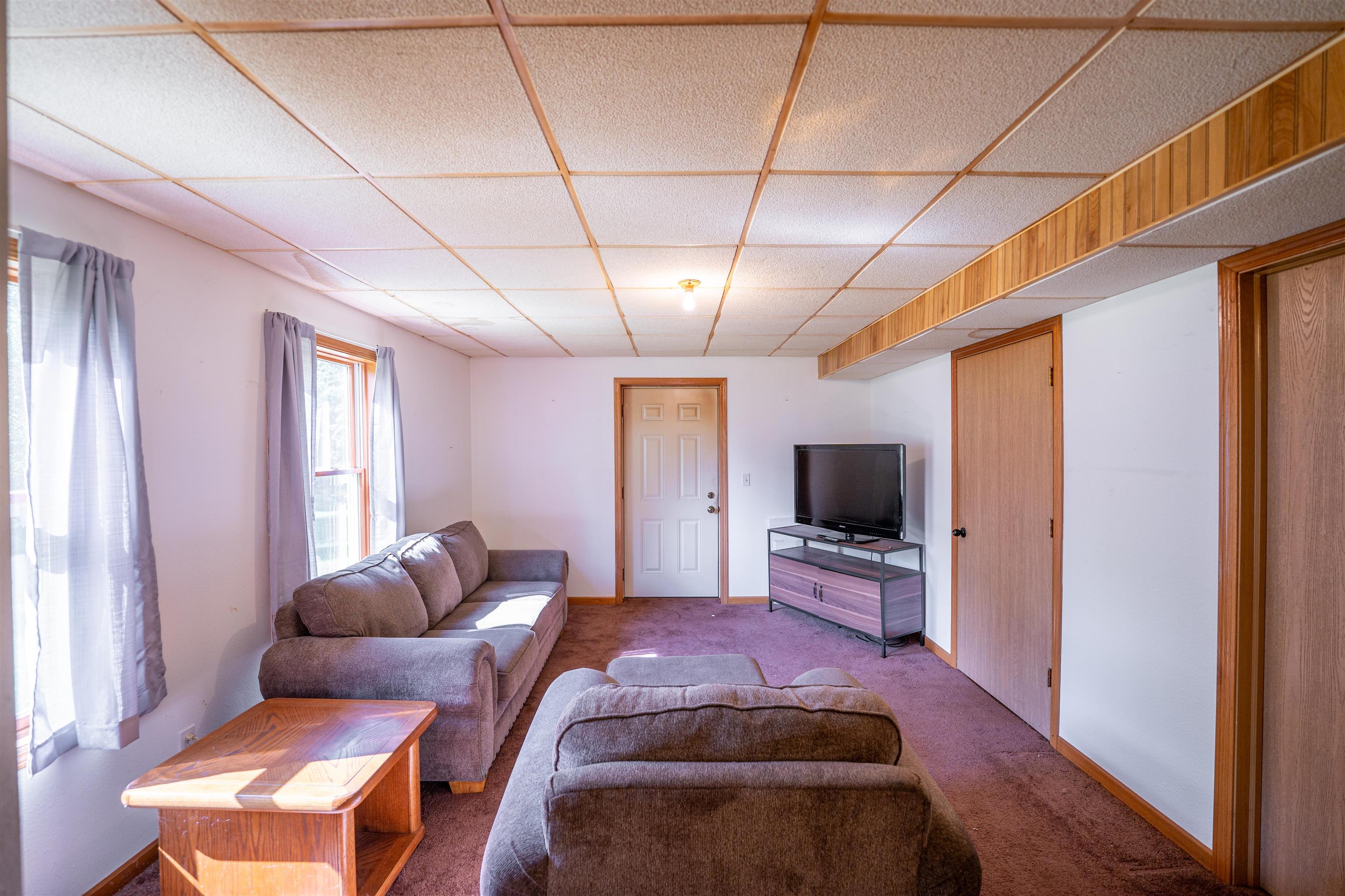 1912 Daysville Road Oregon, IL 61061 - Photo 48 of 74 a spacious bedroom with a bed and glass windows