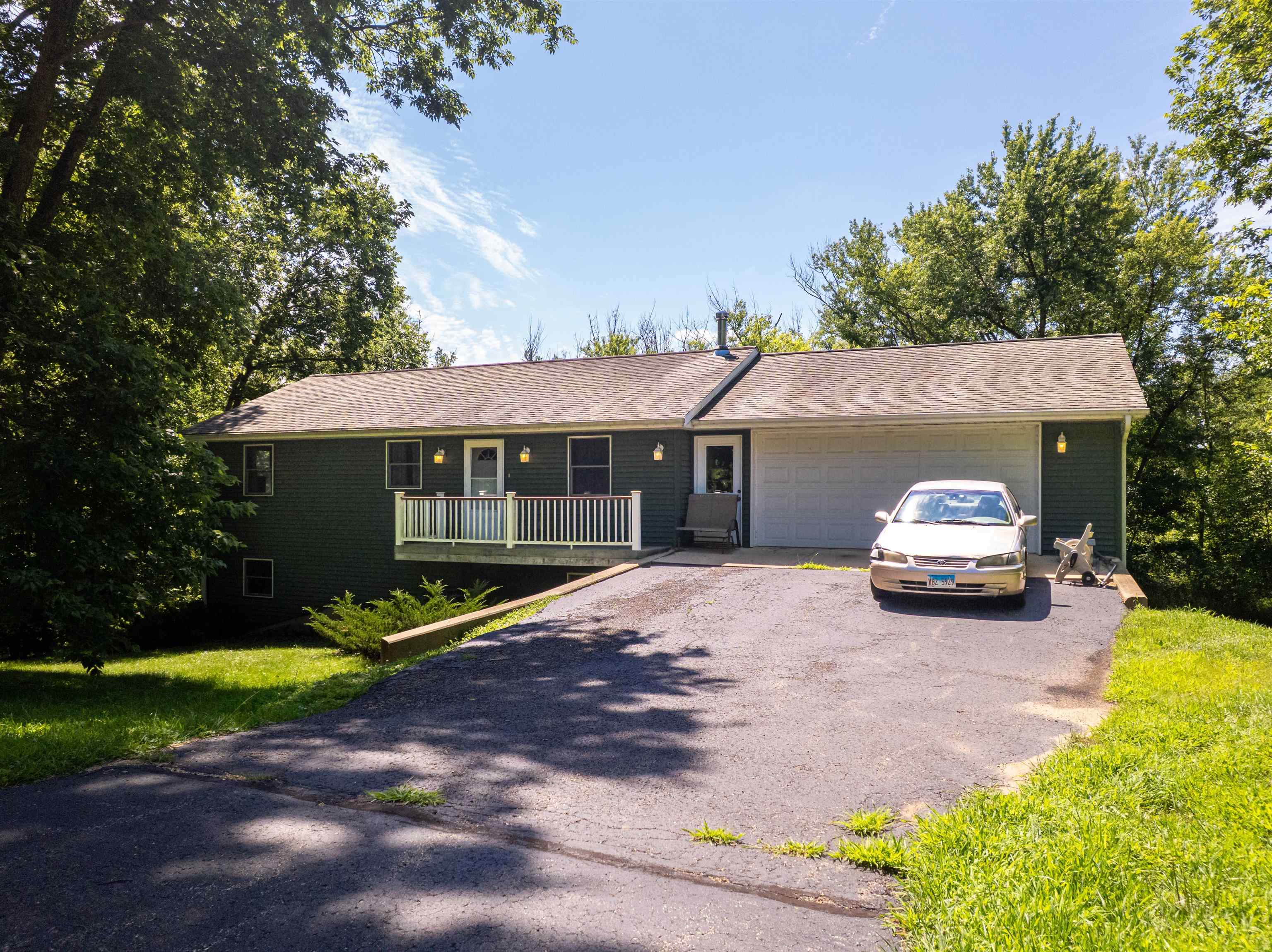 1912 Daysville Road Oregon, IL 61061 - Photo 7 of 74 a car parked in front of a house