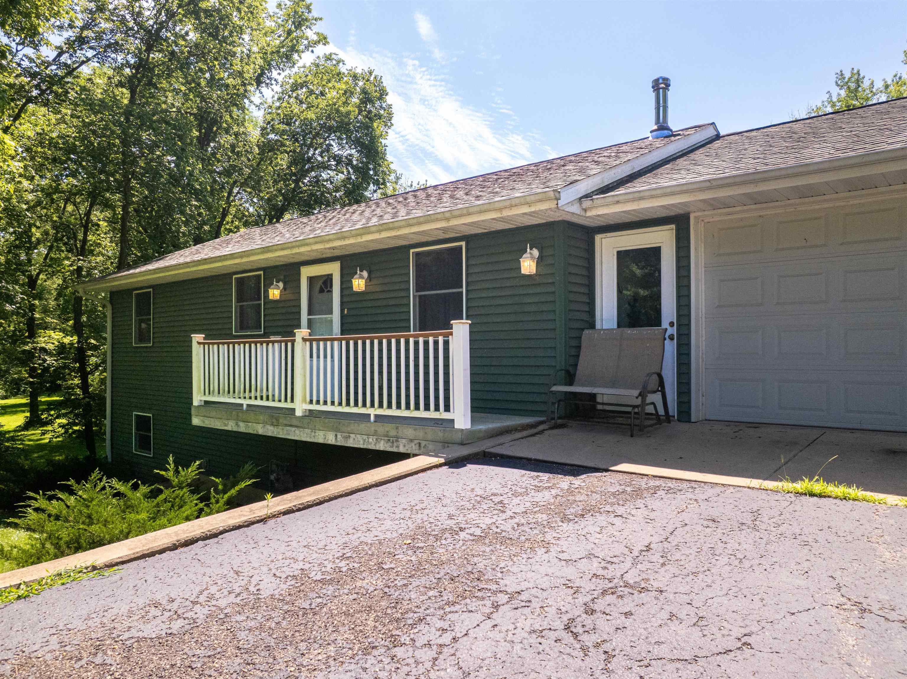 1912 Daysville Road Oregon, IL 61061 - Photo 8 of 74 a front view of a house with a garden