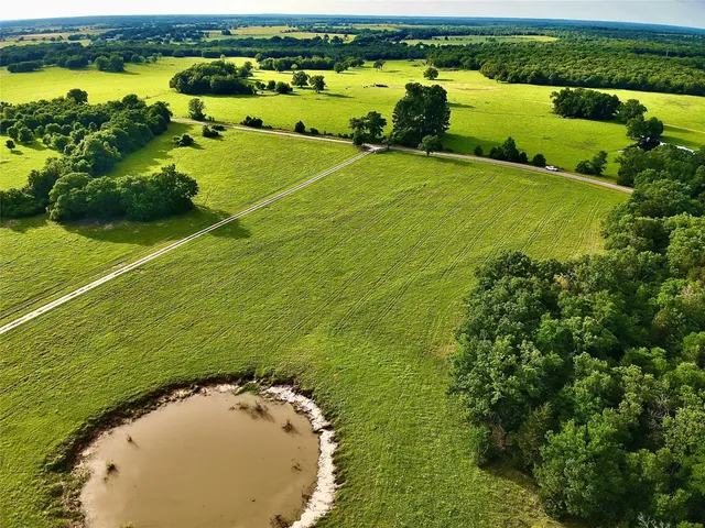 an aerial view of a golf course with a ocean view