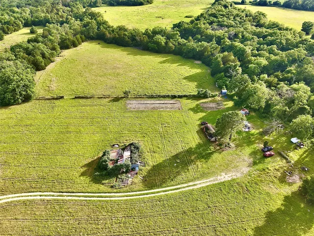 a view of a swimming pool and an outdoor space