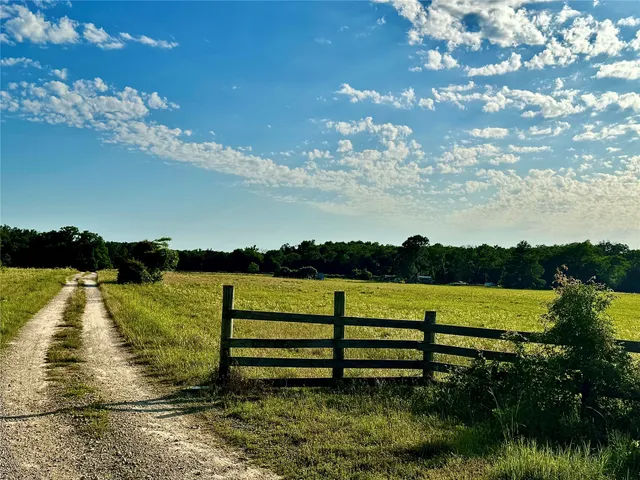 a view of a lake with a yard