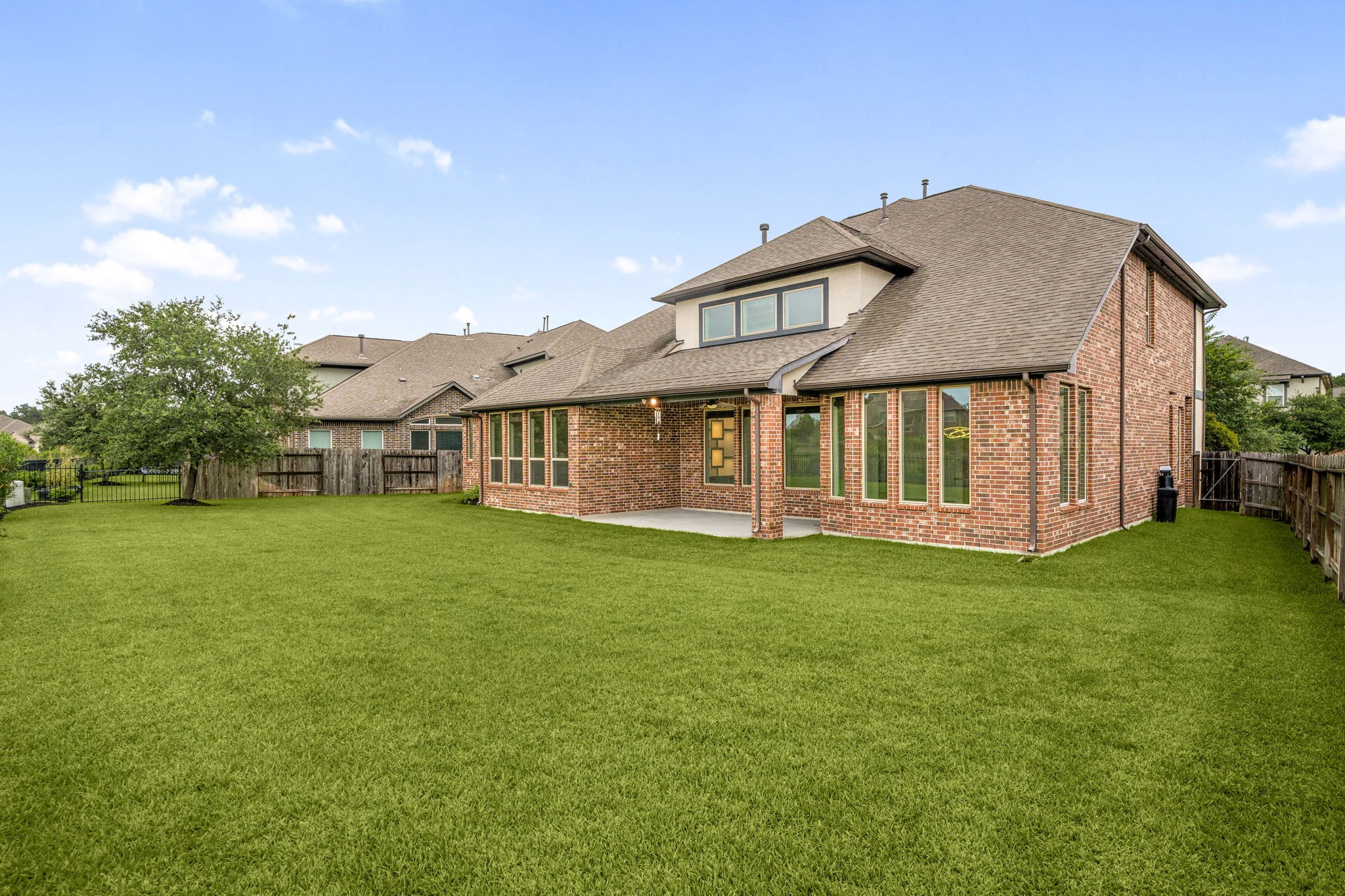 3622 Sage Hollow Drive Spring, TX 77386 - Photo 34 of 46 The sprawling corner lot expands across 10,549 square feet , offering a beautifully manicured green lawn entirely enclosed by a full cedar privacy fence.