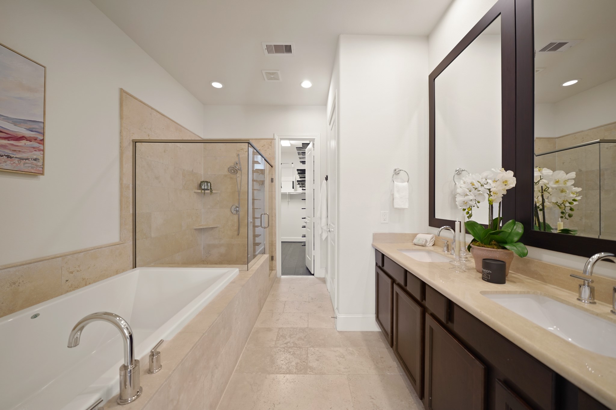 1317 Roy Street Houston, TX 77007 - Photo 22 of 50 The luxurious owner’s bath features beautiful travertine tile flooring and recessed lights.