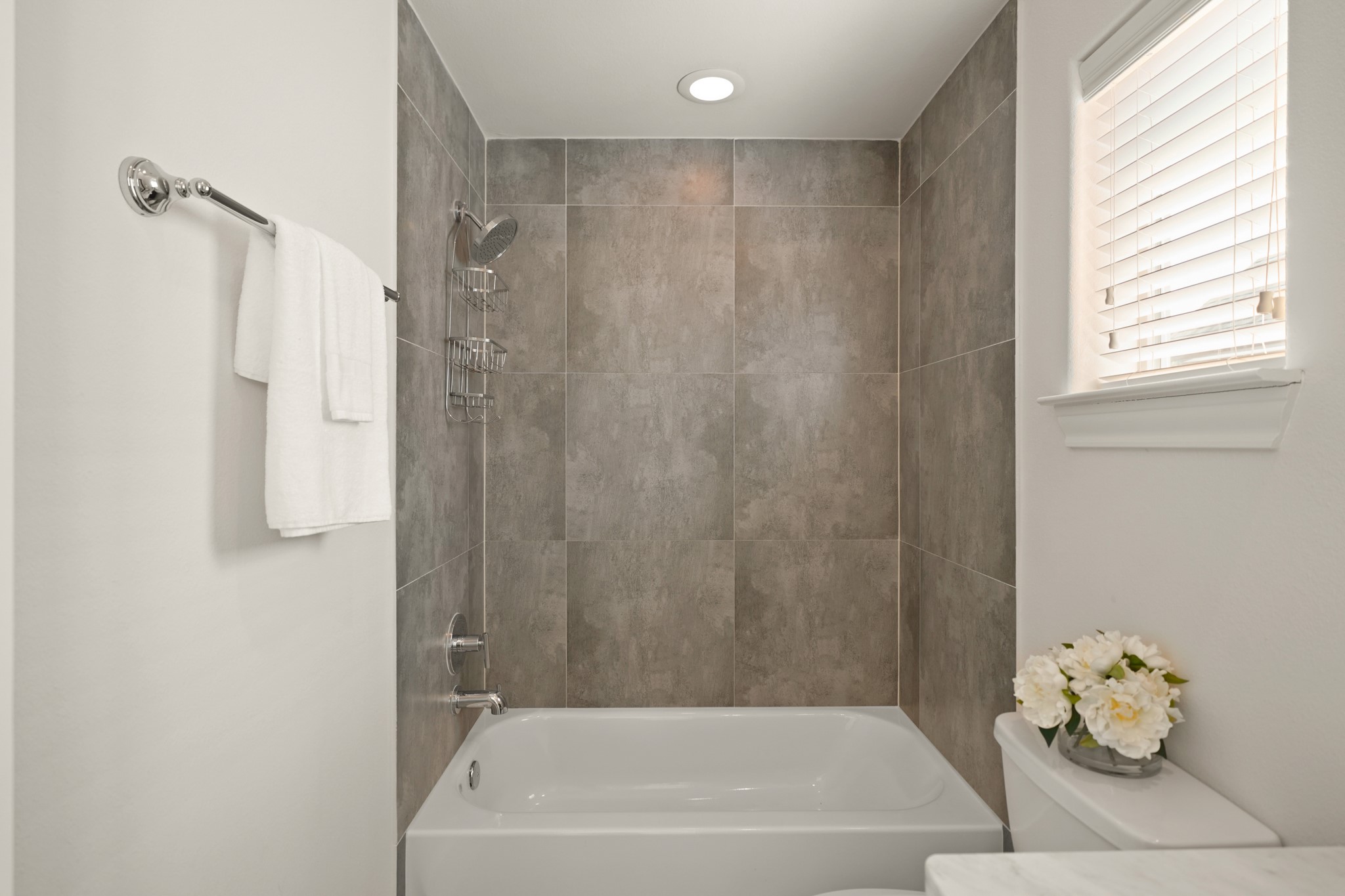 1317 Roy Street Houston, TX 77007 - Photo 31 of 50 The bathroom also features a tile surrounded tub and shower combination with an oversized showerhead.