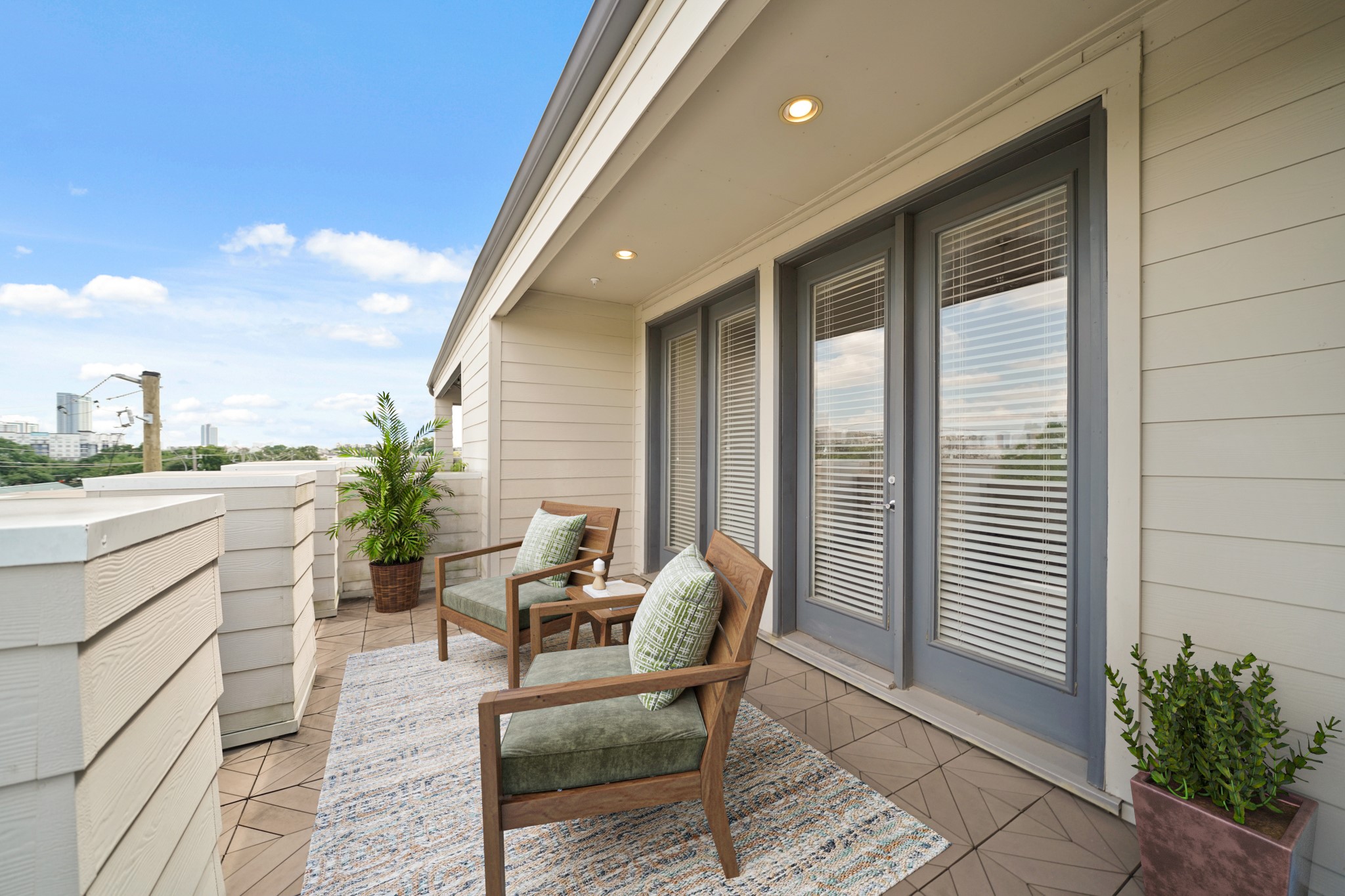 1317 Roy Street Houston, TX 77007 - Photo 37 of 50 The covered area features recessed lighting and creates a shaded spot for relaxing or dining outdoors. The terrace also includes a gas stub for grilling, a water spigot, and lovely views of the skyline. This picture has been virtually staged.