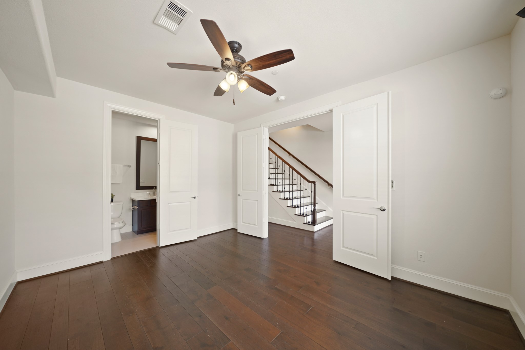 1317 Roy Street Houston, TX 77007 - Photo 46 of 50 With a double door entry, the fourth bedroom features an ensuite bath just through the door on the left.