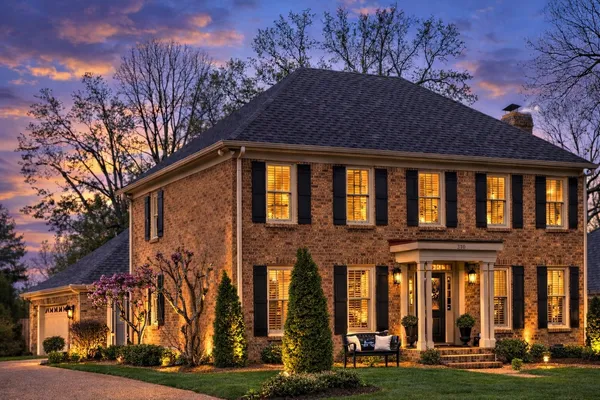 a front view of building with yard